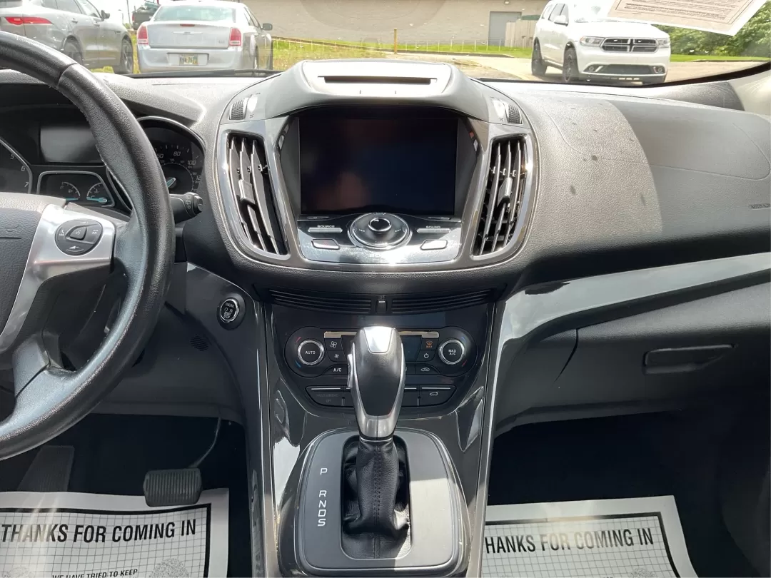 2015 Ford Escape Titanium (1FMCU9J95FU) with an Other engine, located at 1230 East Main St, Xenia, OH, 45385, (937) 908-9800, 39.688026, -83.910172 - Discover your next adventure with the 2015 Ford Escape Titanium, now available at Advantage Car and Credit in Fairborn, OH! Whether you're looking for a family-friendly SUV, a reliable commuter vehicle, or a versatile option for weekend getaways, this Escape checks all the boxes. With a stunning Tux - Photo#12