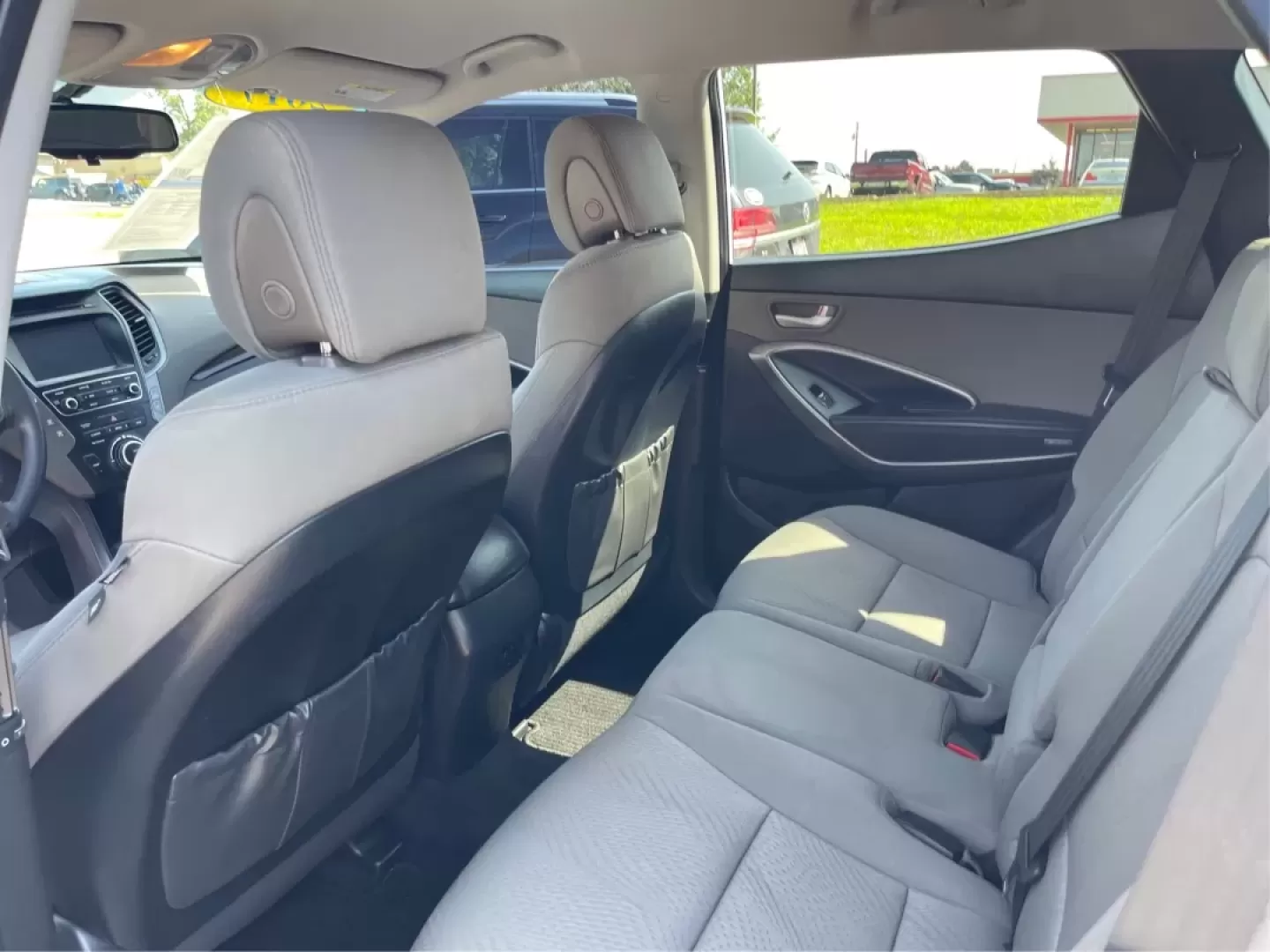 2017 Hyundai Santa Fe 2.4L (5XYZU3LB3HG) with an Theta II 2.4L I-4 gasoline direct injection engine, located at 1230 East Main St, Xenia, OH, 45385, (937) 908-9800, 39.688026, -83.910172 - Are you ready to elevate your family adventures with a premium SUV that seamlessly blends style, comfort, and reliability? Look no further than this stunning 2017 Hyundai Santa Fe, available now at Advantage Car and Credit in Fairborn, OH. Whether you're commuting to work, heading out on a family ro - Photo#10