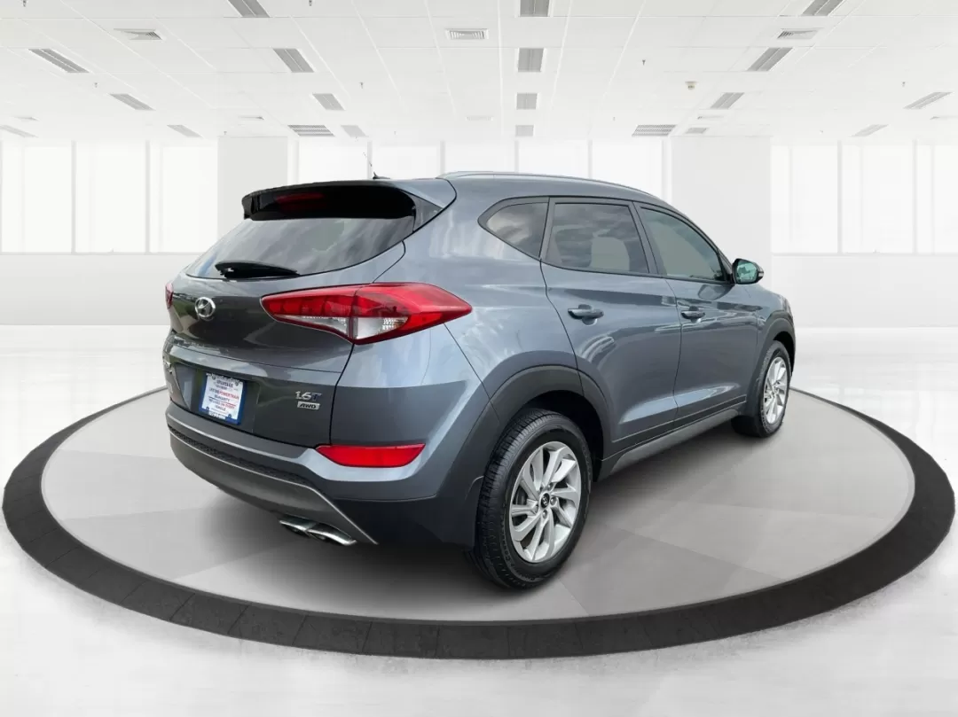 2016 Hyundai Tucson Eco (KM8J3CA24GU) with an 1.6L I-4 gasoline direct injection engine, located at 8750 N County Rd 25A, Piqua, OH, 45356, (937) 908-9800, 40.164391, -84.232513 - Photo#2