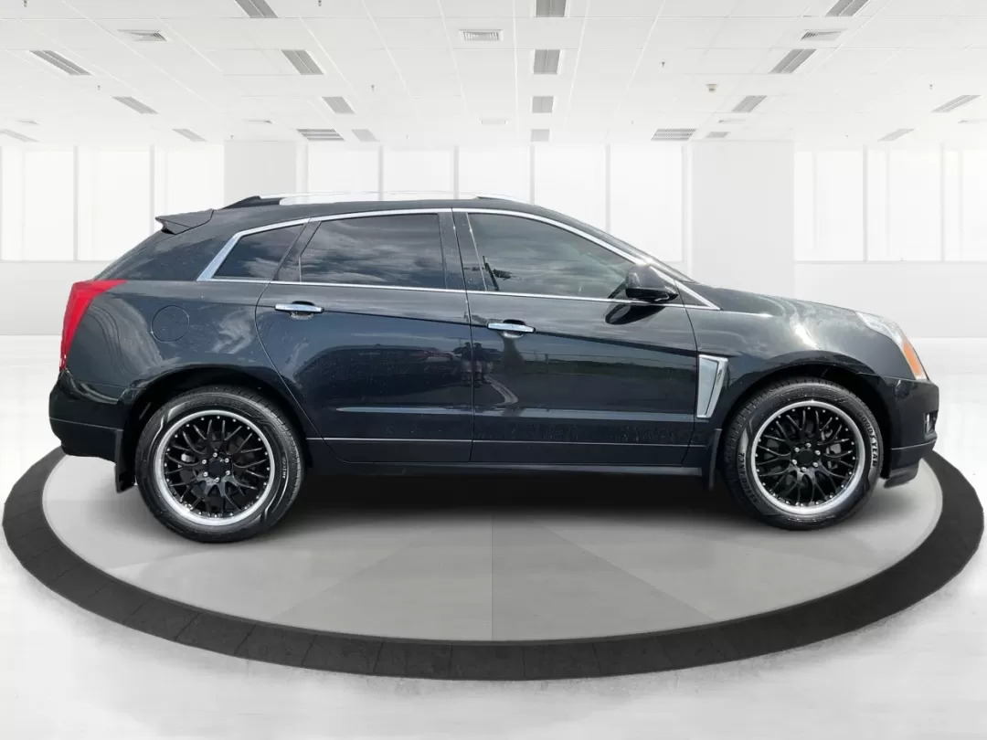 2013 Cadillac SRX Premium Collection (3GYFNJE34DS) with an 3.6L V-6 gasoline direct injection engine, located at 401 Woodman Dr, Riverside, OH, 45431, (937) 908-9800, 39.760899, -84.123421 - Photo#1