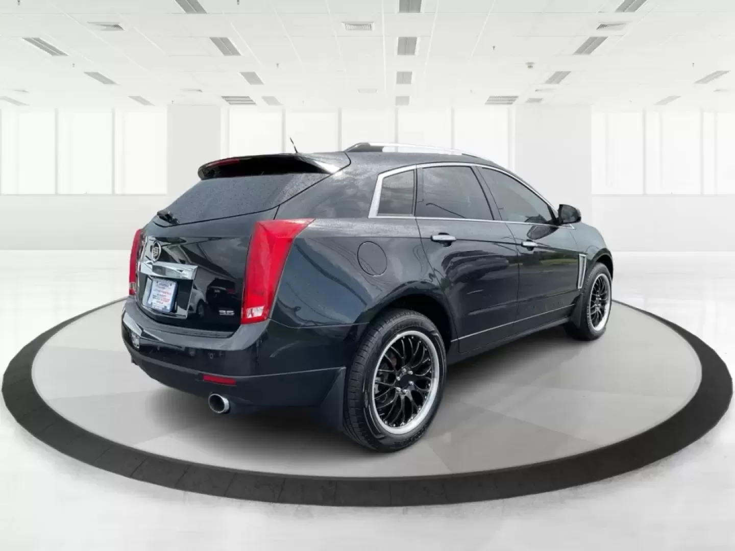 2013 Cadillac SRX Premium Collection (3GYFNJE34DS) with an 3.6L V-6 gasoline direct injection engine, located at 401 Woodman Dr, Riverside, OH, 45431, (937) 908-9800, 39.760899, -84.123421 - Photo#2