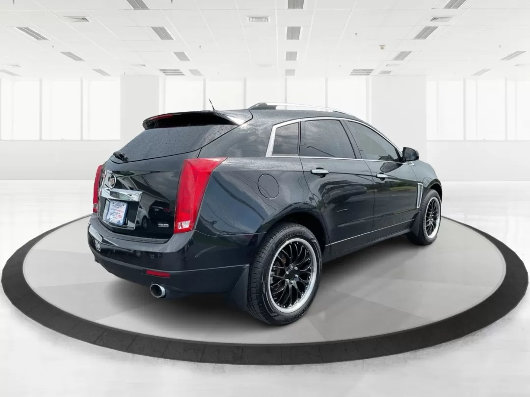 2013 Cadillac SRX Premium Collection (3GYFNJE34DS) with an 3.6L V-6 gasoline direct injection engine, located at 401 Woodman Dr, Riverside, OH, 45431, (937) 908-9800, 39.760899, -84.123421 - Photo#2