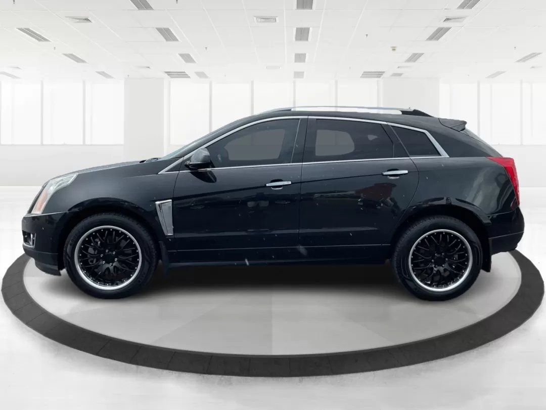 2013 Cadillac SRX Premium Collection (3GYFNJE34DS) with an 3.6L V-6 gasoline direct injection engine, located at 401 Woodman Dr, Riverside, OH, 45431, (937) 908-9800, 39.760899, -84.123421 - Photo#5