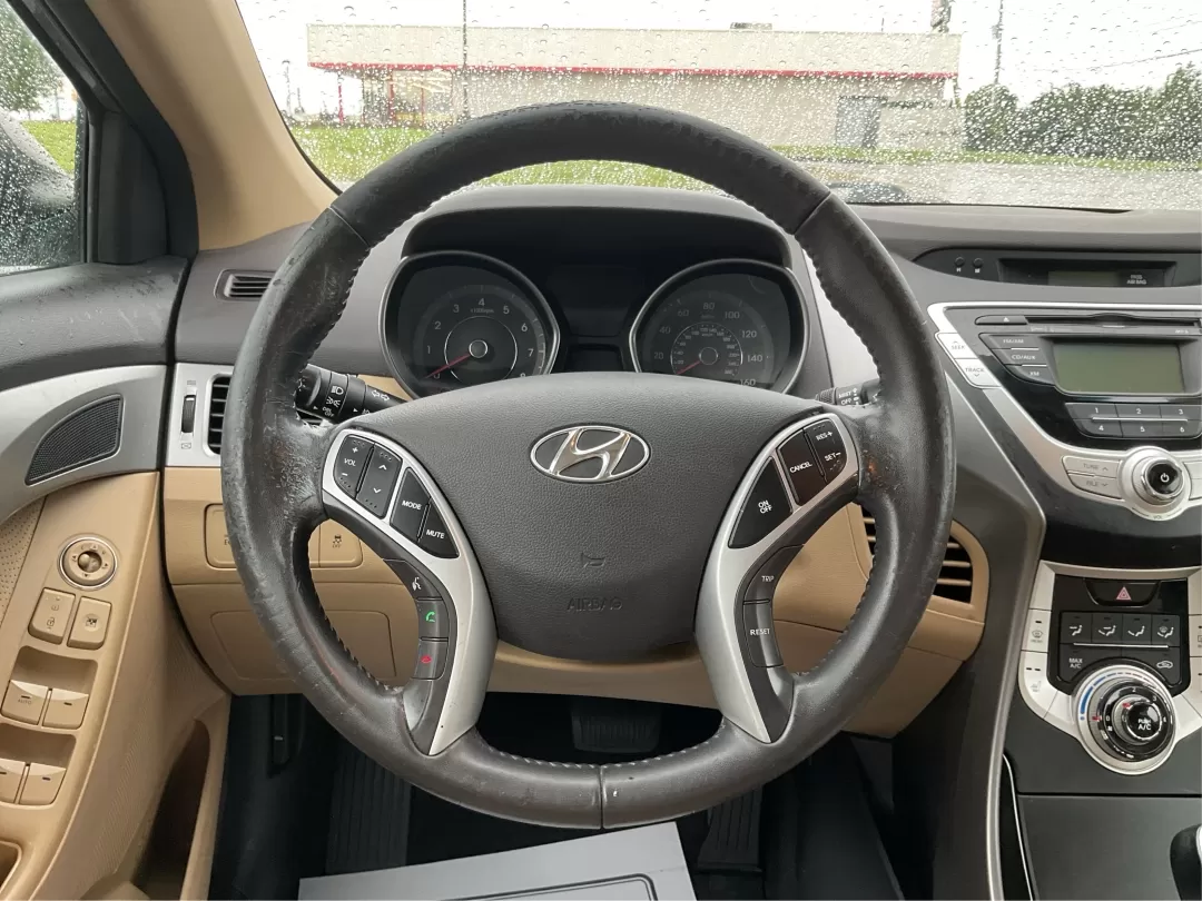 2012 Hyundai Elantra Limited (5NPDH4AE8CH) with an 1.8L I-4 DOHC engine, located at 401 Woodman Dr, Riverside, OH, 45431, (937) 908-9800, 39.760899, -84.123421 - 2012 Hyundai Elantra Limited - Photo#16