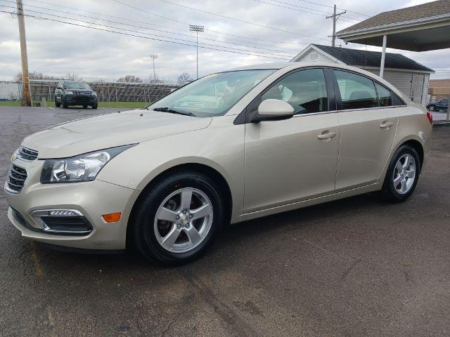 2016 Gold Chevrolet Cruze Limited 1LT Auto (1G1PE5SB0G7) with an 1.4L L4 DOHC 16V TURBO engine, 6-Speed Automatic transmission, located at 1951 S Dayton Lakeview Rd., New Carlisle, OH, 45344, (937) 908-9800, 39.890999, -84.050255 - Photo #2