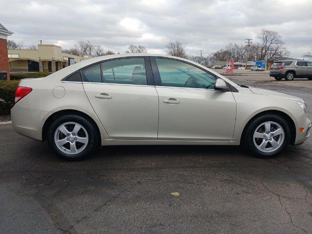 2016 Gold Chevrolet Cruze Limited 1LT Auto (1G1PE5SB0G7) with an 1.4L L4 DOHC 16V TURBO engine, 6-Speed Automatic transmission, located at 1951 S Dayton Lakeview Rd., New Carlisle, OH, 45344, (937) 908-9800, 39.890999, -84.050255 - Photo #4