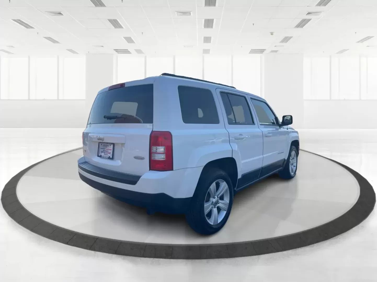 2014 Jeep Patriot Latitude (1C4NJPFB0ED) with an 2.4L I-4 DOHC engine, located at 1951 S Dayton Lakeview Rd., New Carlisle, OH, 45344, (937) 908-9800, 39.890999, -84.050255 - Photo#2