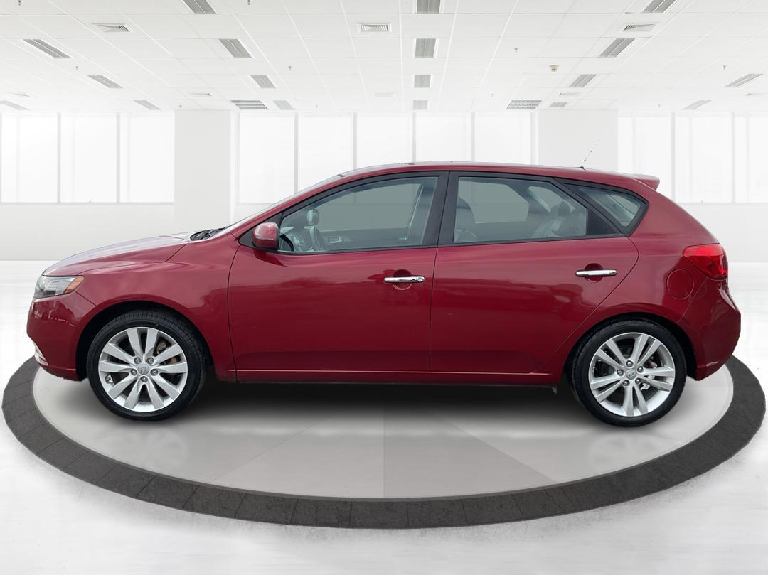 2011 Spicy Red Metallic Kia Forte 5-Door SX (KNAFW5A33B5) with an 2.4L L4 DOHC 16V engine, located at 1230 East Main St, Xenia, OH, 45385, (937) 908-9800, 39.688026, -83.910172 - 2011 Kia Forte 5-Door SX - Photo#5