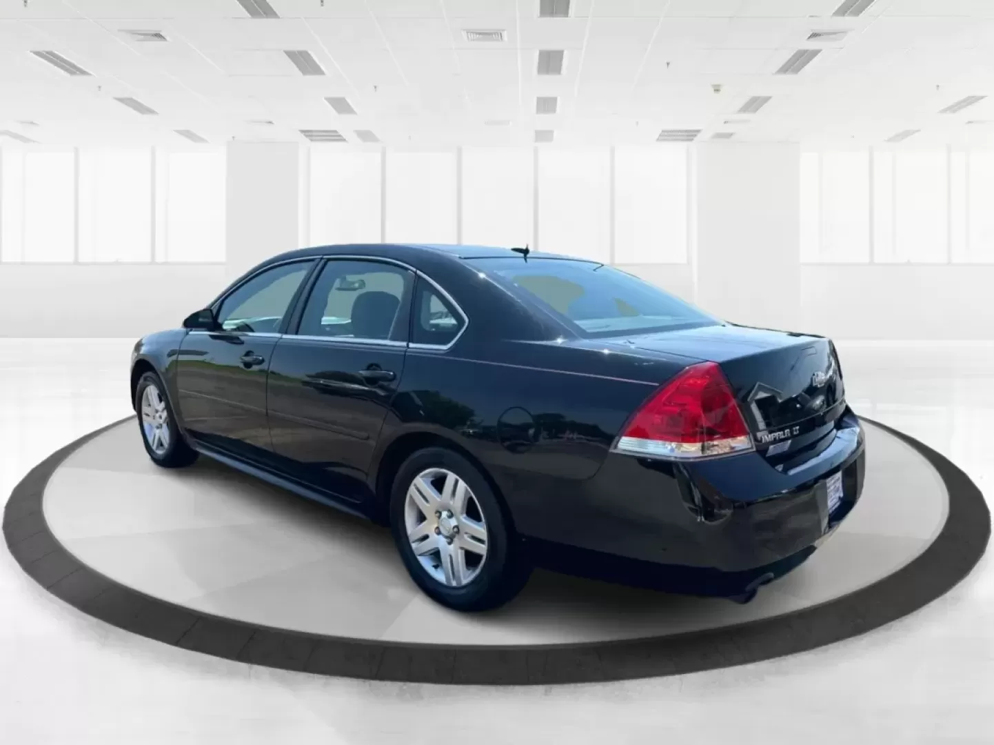 2014 Chevrolet Impala Limited LT (2G1WB5E3XE1) with an 3.6L V-6 gasoline direct injection engine, located at 1951 S Dayton Lakeview Rd., New Carlisle, OH, 45344, (937) 908-9800, 39.890999, -84.050255 - Are you ready for your next adventure, whether it's a family road trip, a daily commute, or simply running errands around Fairborn? The 2014 Chevrolet Impala Limited LT is the perfect sedan to elevate your driving experience. With its stylish black exterior and reliable performance, this vehicle is - Photo#4